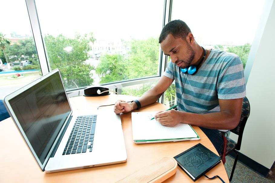 student studying with laptop